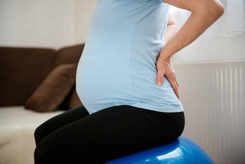 Болит низ живота и поясница при беременности, почему тянет спину