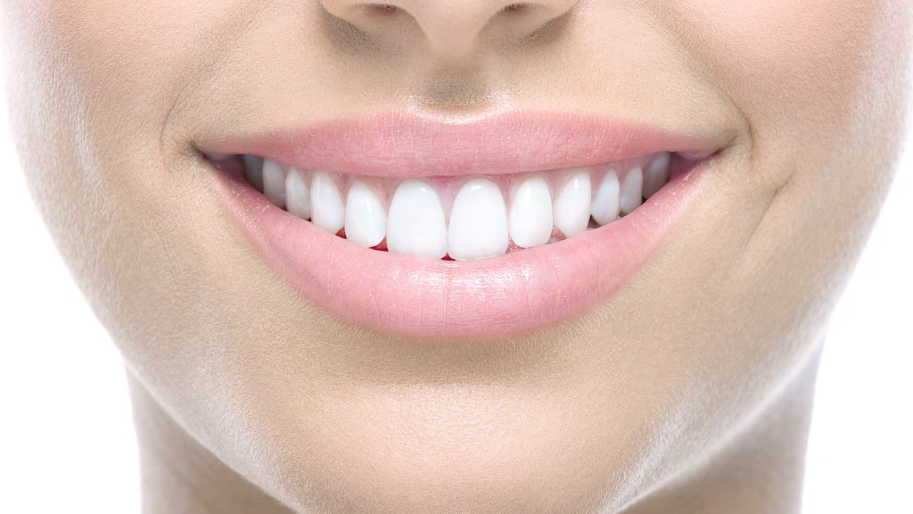 Почему повреждается зубная эмаль?